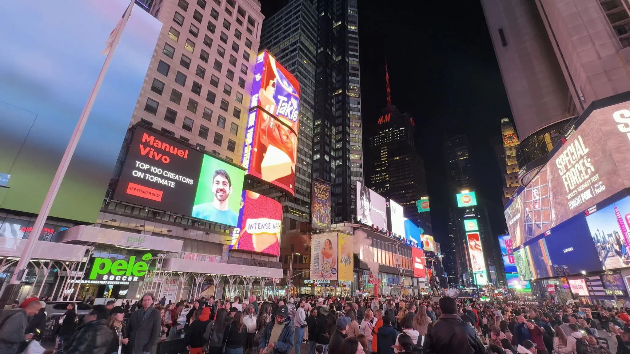 Manuel Vivo at a Times Square's billboard
